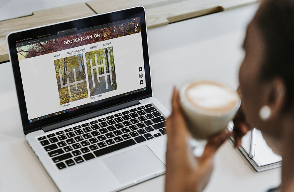 image of a woman viewing the webpage of georgetown history